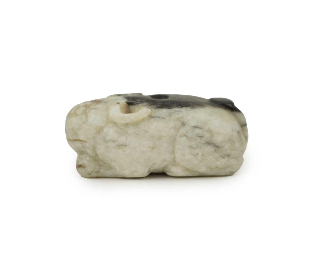 A Chinese white and black jade figure of a recumbent tiger, Song dynasty